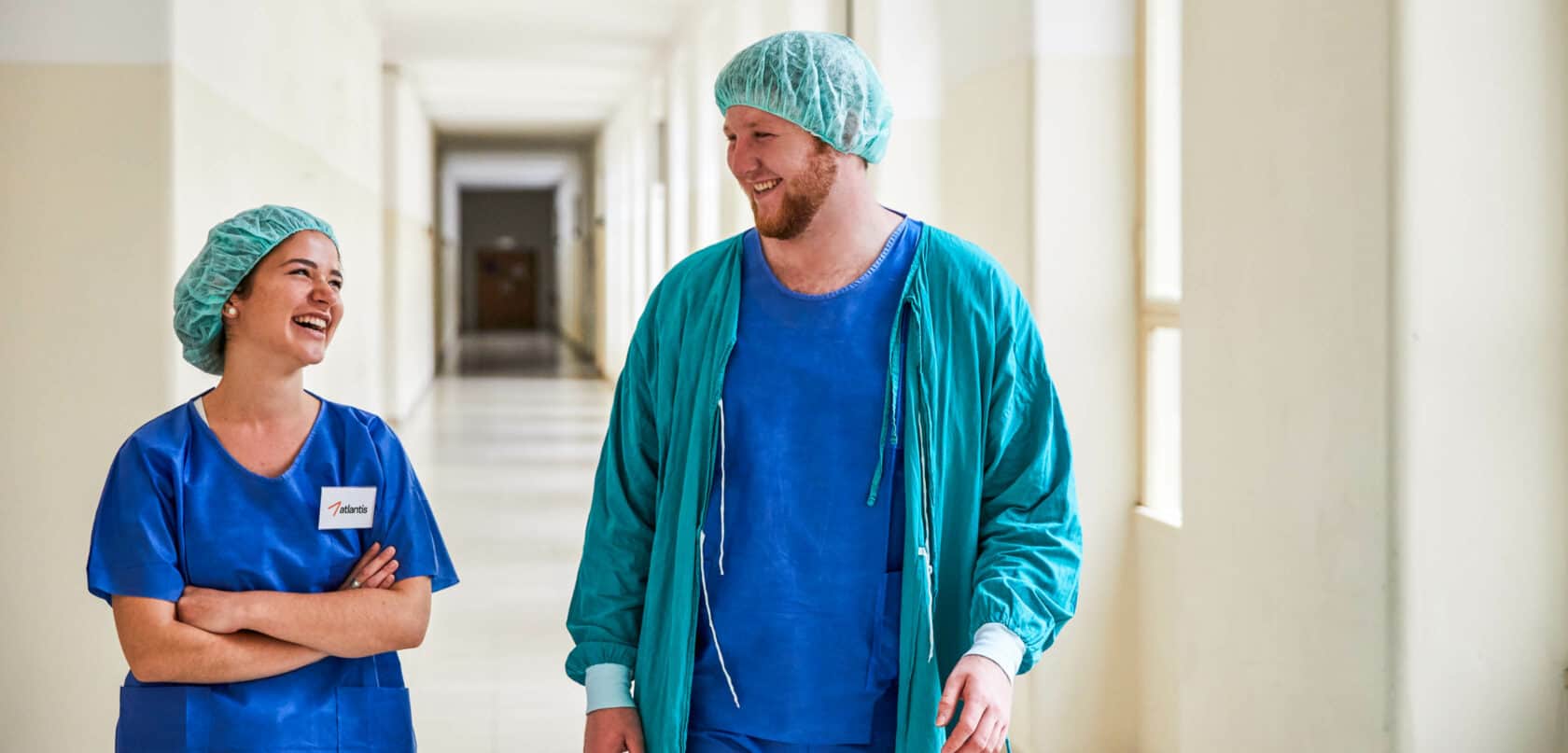 Students walking down a hallway in the hospital.